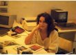 Interview with Laura Maestri Laura sitting at desk in 1986